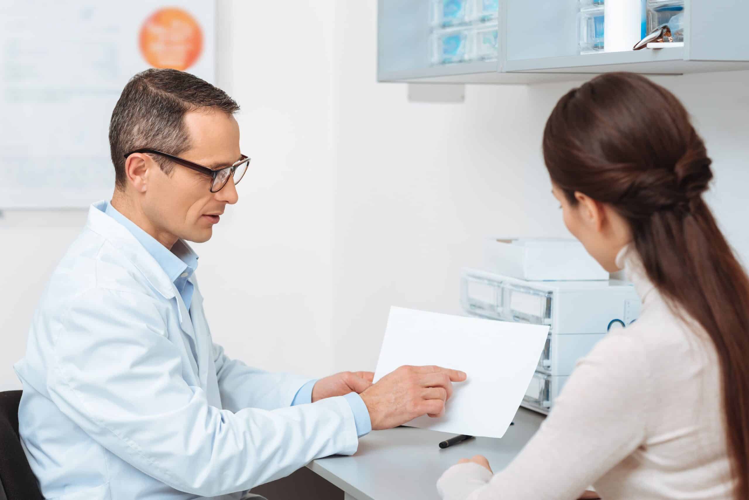 Eye doctor speaking to a patient